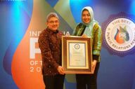 XL Axiata Borong Empat...