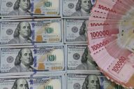 Rupiah Bergerak Melemah...