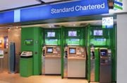 Standard Chartered pangkas...