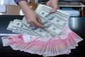 Rupiah kembali mengalami...
