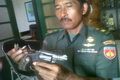 Revolver 9 mm di buang...