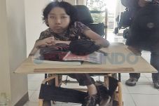Kursi Roda Tak Menghalanginya...