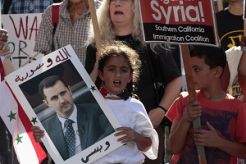 Jelang putusan perang, Obama & Assad adu opini