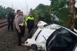 Mobil Terobos Perlintasan, PNS DKI Tewas Terseret Kereta Api