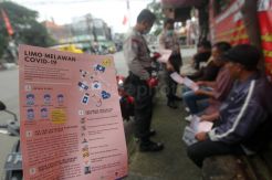 Babinkamtibmas Sosialisasi Pencegahan Covid-19 di Pangkalan Ojek