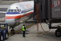 American Airlines pangkas...