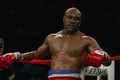 Bayar utang, Holyfield...