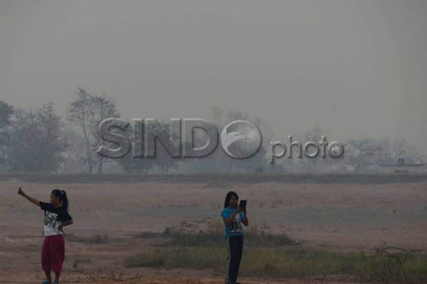 Kabut Asap Tebal Selimuti...