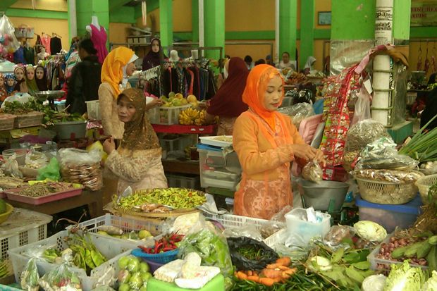 Pedagang Menggunakan...