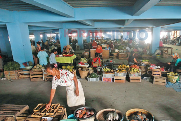Pedagang Jualan di Tempat...