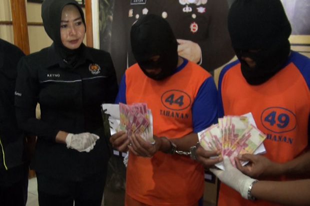 Dua Pengedar Uang Palsu...