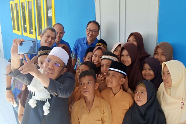 XL Axiata Sukses Bangun...