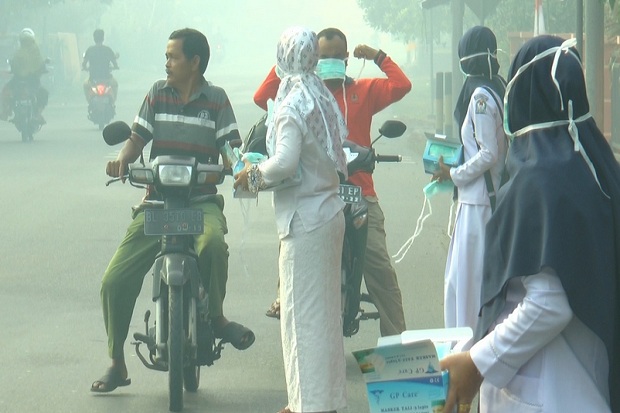 Kabut Asap Tebal Kepung...