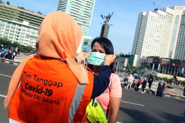 Wabah Corona Meluas,...