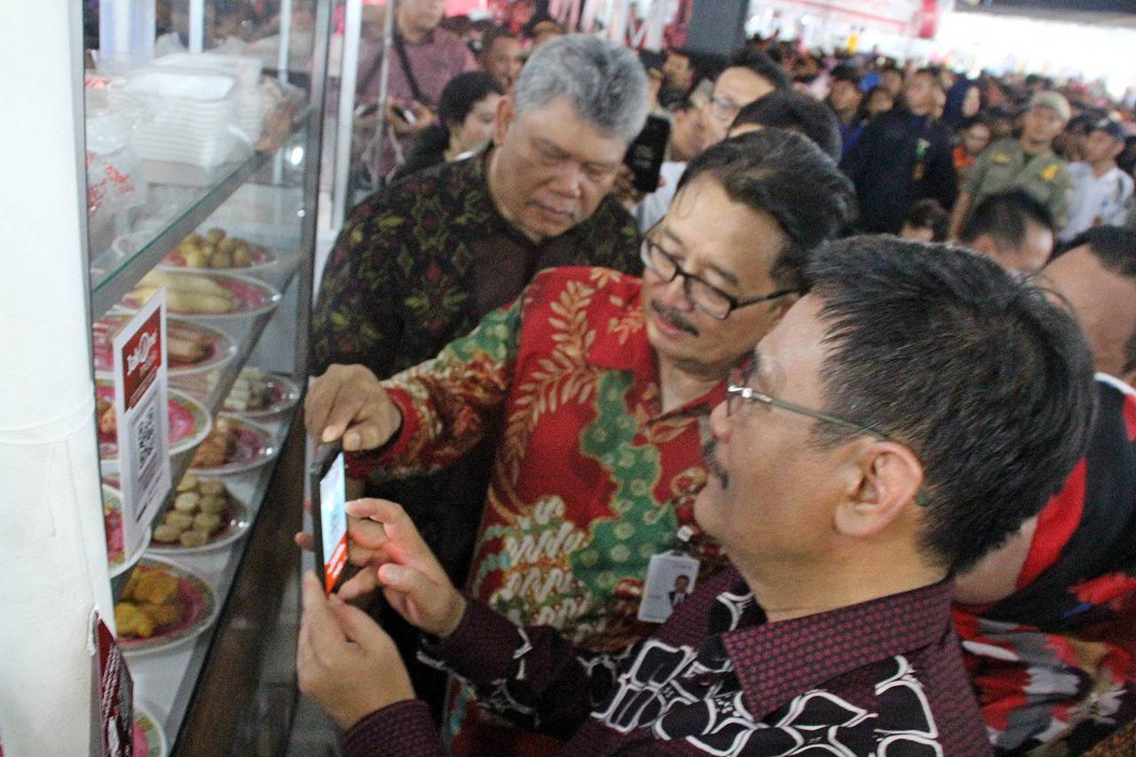 Transaksi Menggunakan...