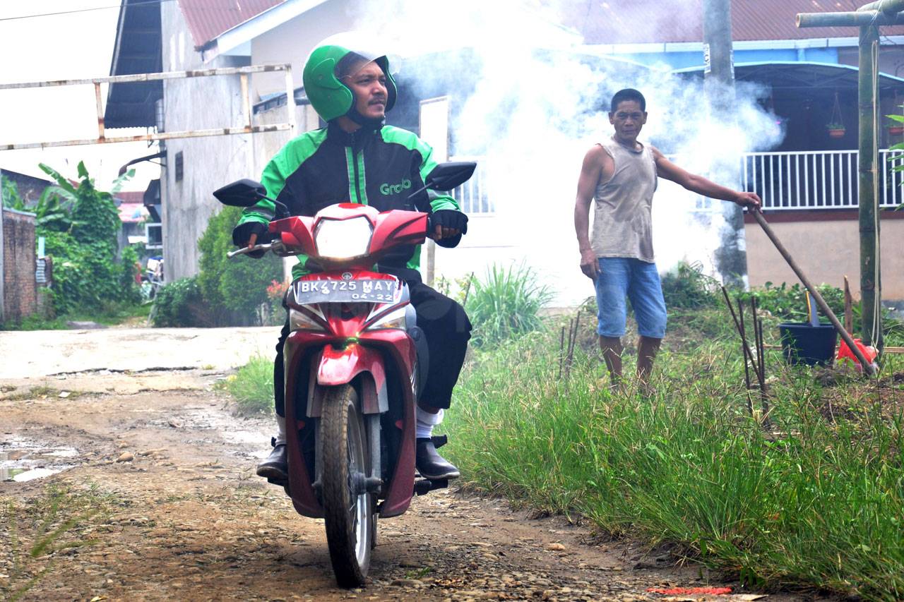Pengemudi Ojol Erwin...